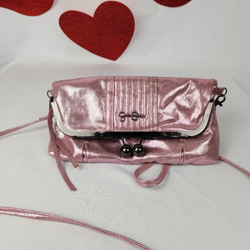 Jessica Simpson Vintage shimmery pink metalic fold over crossbody clutch.
